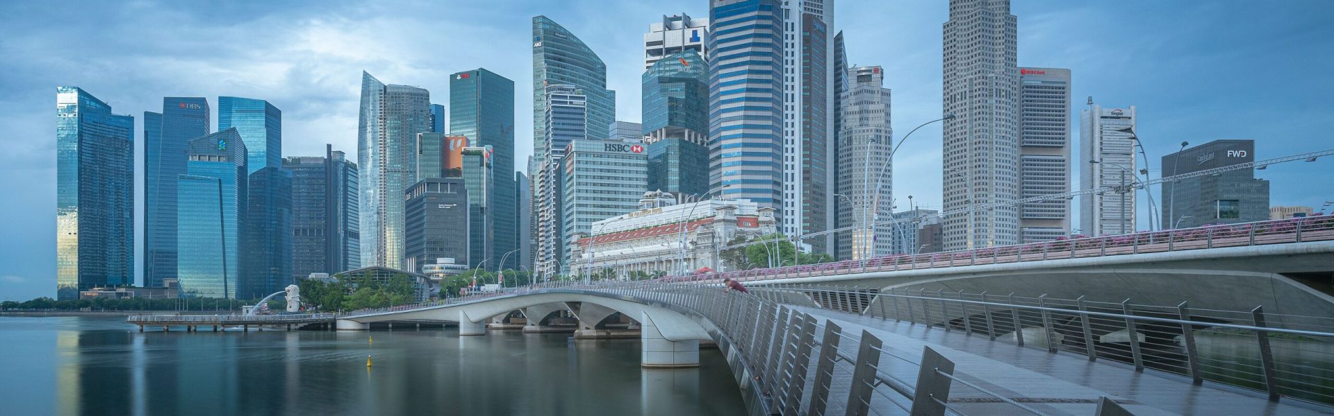 Breathtaking view of Singapore's skyline with iconic skyscrapers and Marina Bay in the foreground.